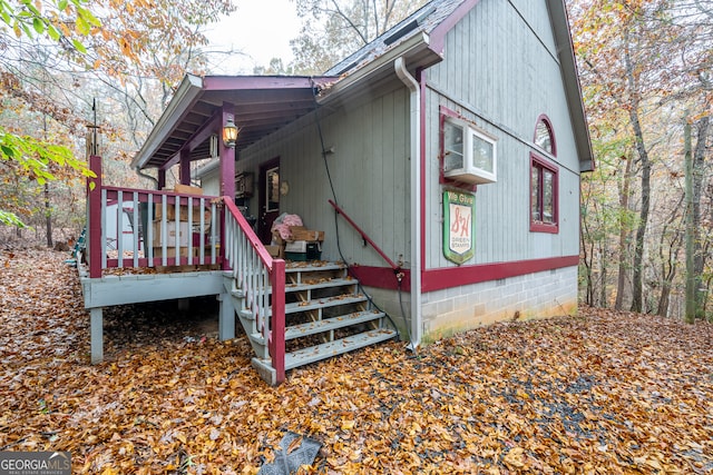 view of side of property with a wooden deck