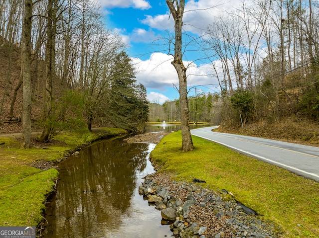 view of road featuring a water view