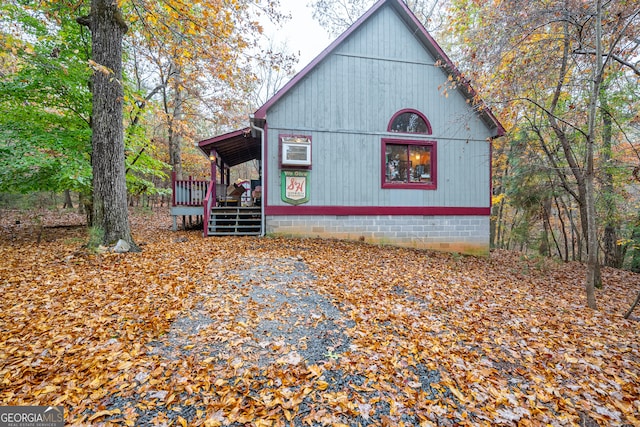 view of home's exterior featuring a wooden deck