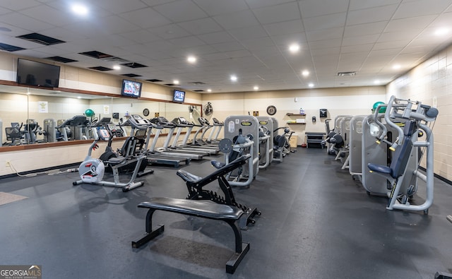 workout area featuring a paneled ceiling