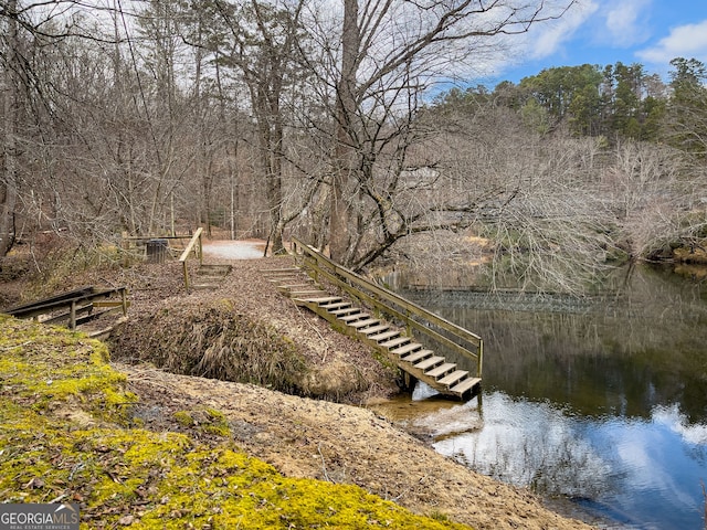 view of community with a water view