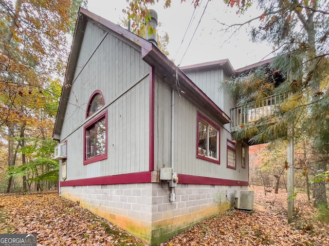 view of side of property with central AC