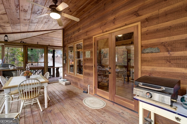 sunroom / solarium with french doors, lofted ceiling, ceiling fan, and wooden ceiling