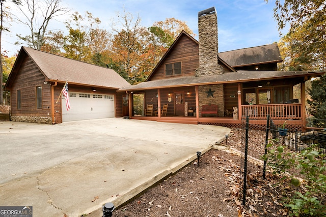 exterior space with a garage and covered porch