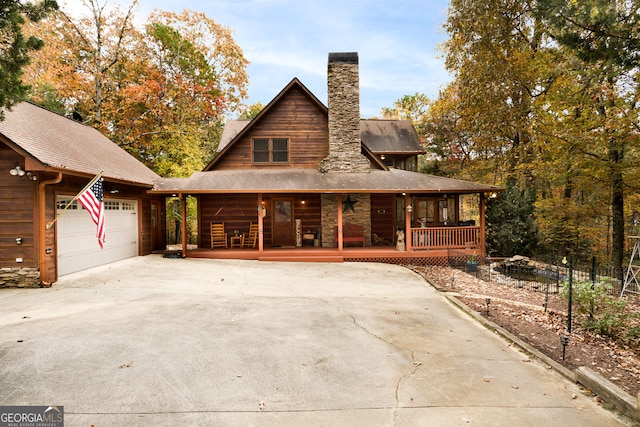 view of front of house with a garage and covered porch