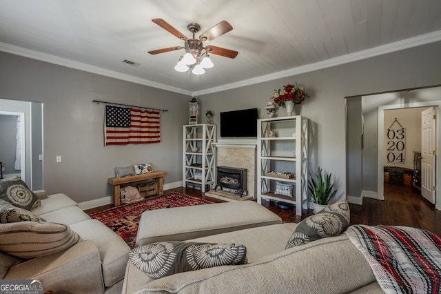 living room with crown molding, ceiling fan, and dark hardwood / wood-style flooring