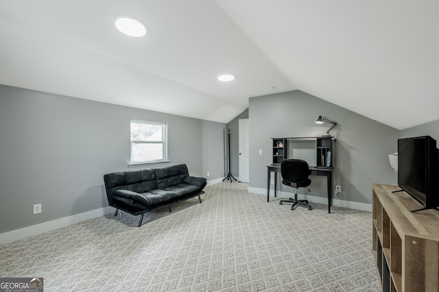 office area with lofted ceiling and light carpet