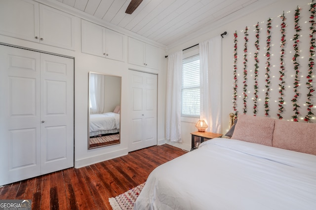 bedroom featuring ceiling fan, wooden ceiling, and dark hardwood / wood-style flooring