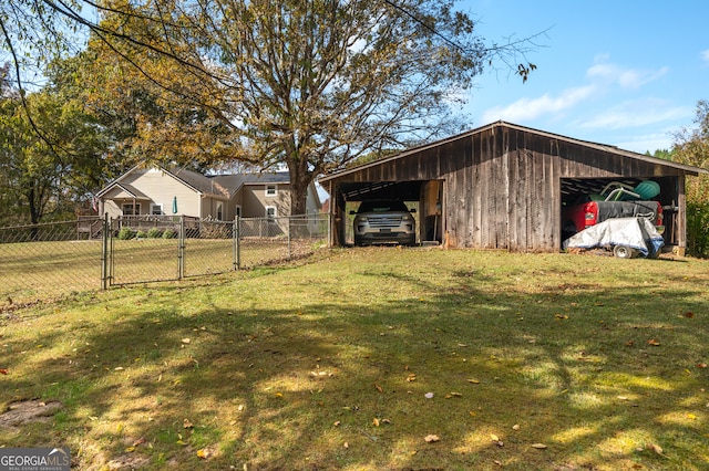 view of yard with an outdoor structure and a carport