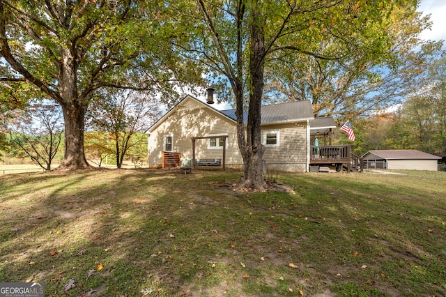 exterior space with a yard and a wooden deck