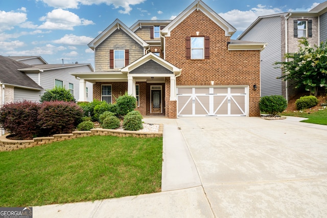 view of front of property featuring a front yard and a garage