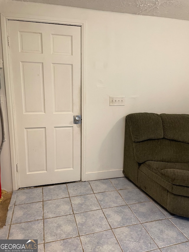 living area featuring light tile patterned flooring