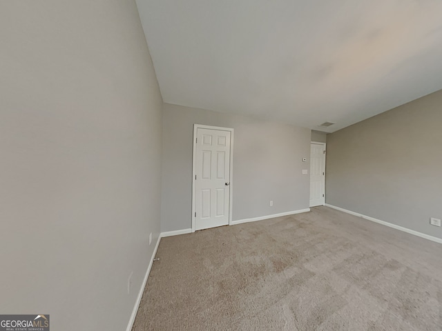 empty room featuring carpet floors