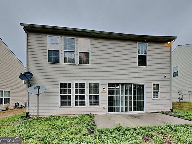 rear view of property with a patio area