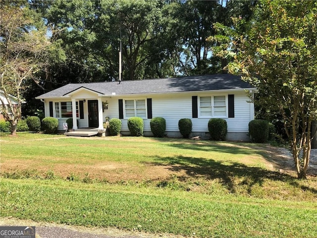 ranch-style home featuring a front yard