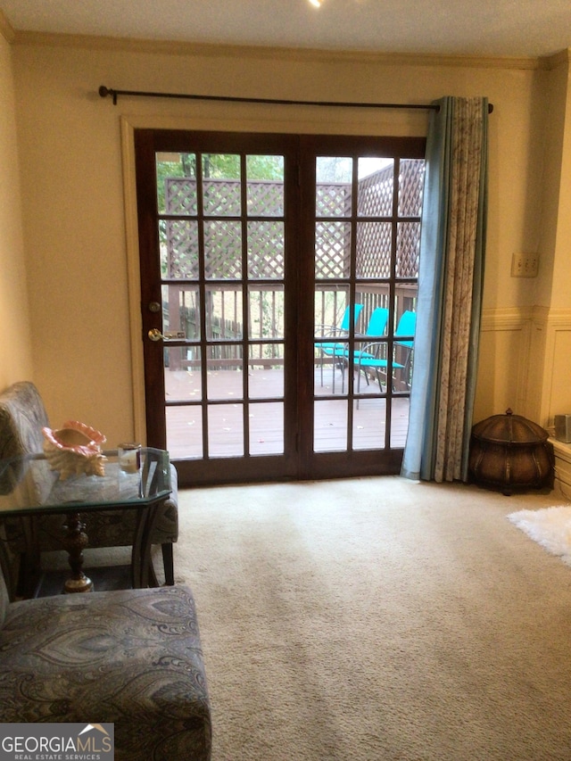 doorway with carpet floors and a textured ceiling