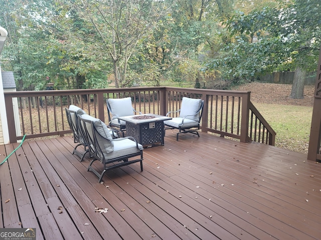 deck featuring an outdoor fire pit