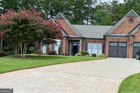 view of front of house with a garage and a front yard