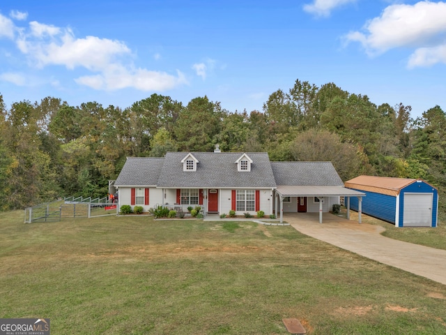 new england style home with covered porch, a garage, a front lawn, a carport, and an outdoor structure