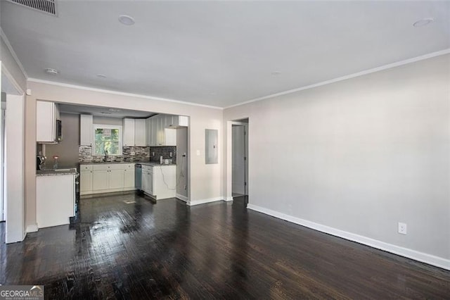 unfurnished living room featuring sink, crown molding, dark wood-type flooring, and electric panel