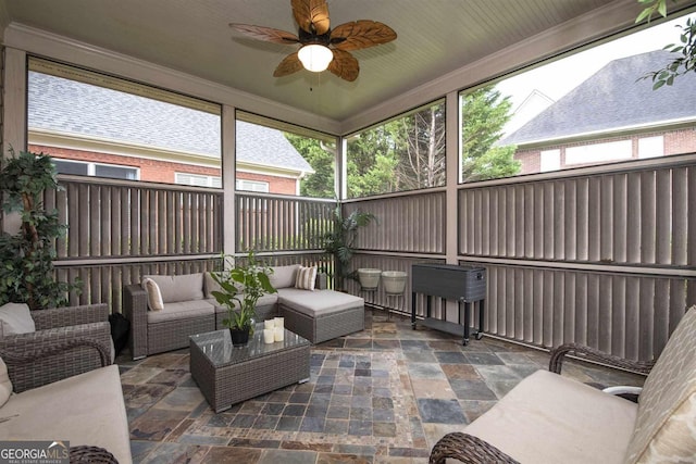 sunroom / solarium with ceiling fan and a healthy amount of sunlight