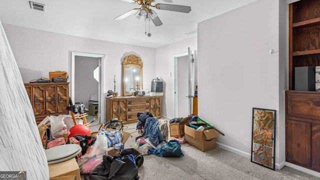 bedroom featuring ceiling fan and light carpet