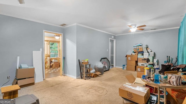 misc room featuring light colored carpet, ceiling fan, and ornamental molding