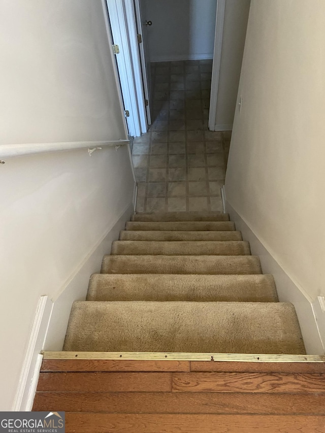 6995 Pine Shadow Way, Winston, GA 30187 - staircase featuring baseboards