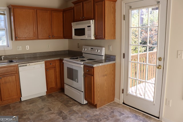 kitchen with sink and white appliances