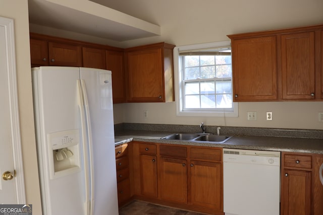 kitchen with white appliances and sink