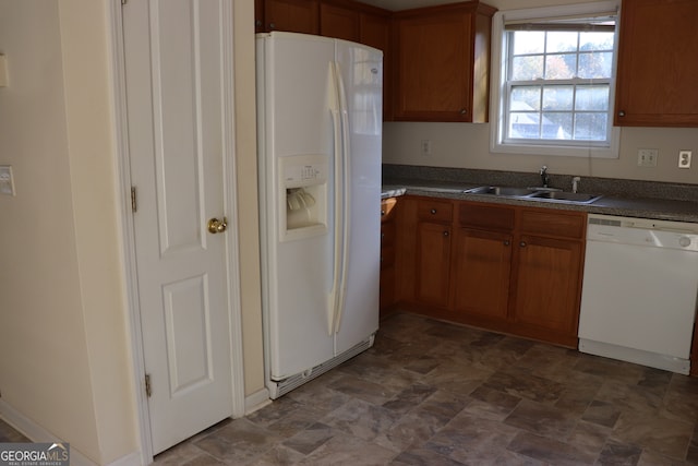 kitchen with sink and white appliances