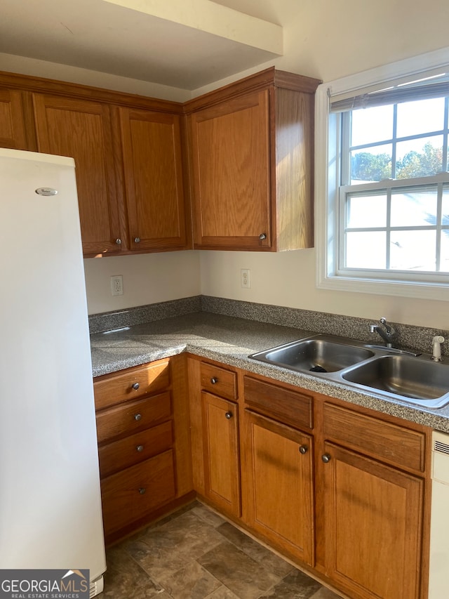 kitchen with white appliances and sink