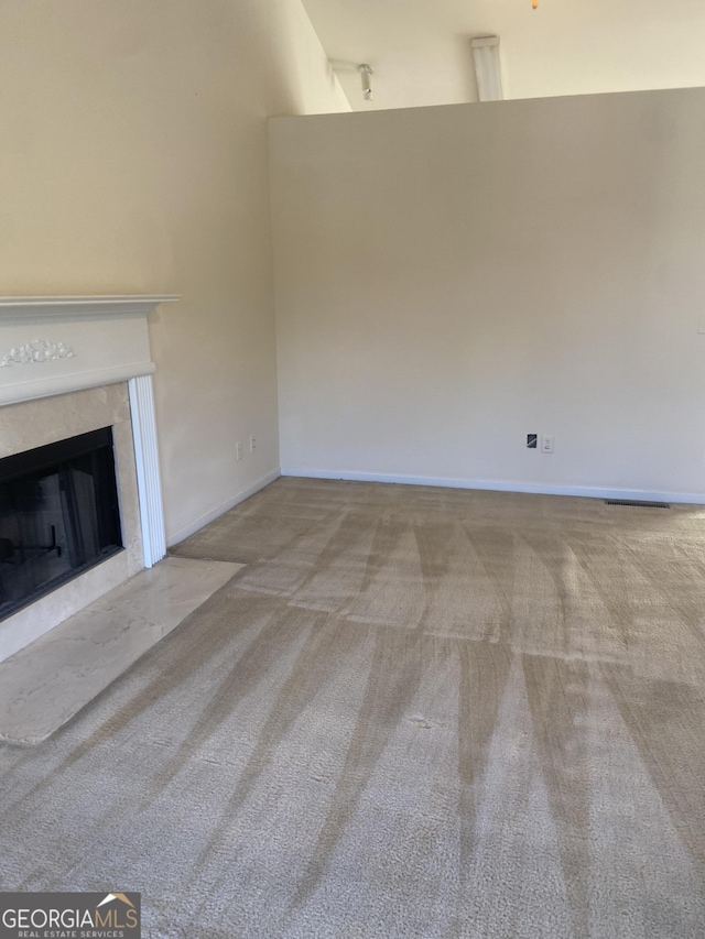 6995 Pine Shadow Way, Winston, GA 30187 - unfurnished living room featuring carpet floors and a premium fireplace
