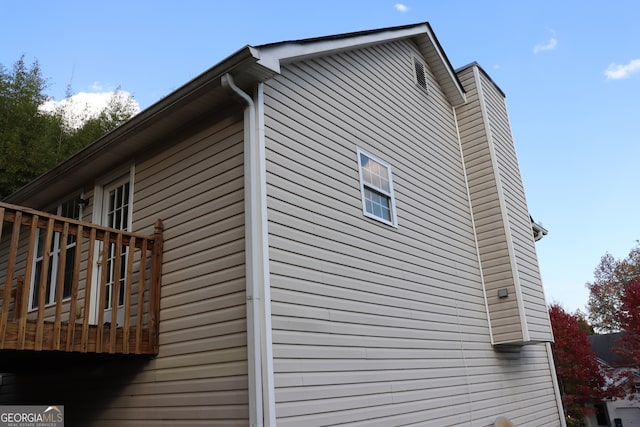 view of home's exterior with a deck