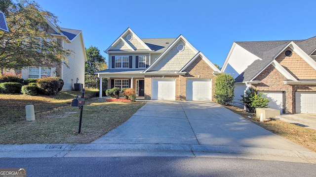 craftsman-style house featuring central air condition unit and a garage