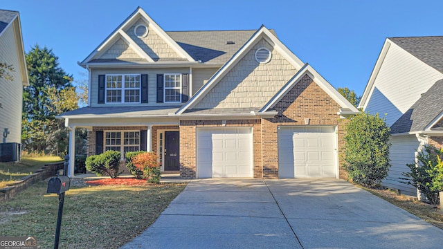 craftsman house featuring a garage and a front yard