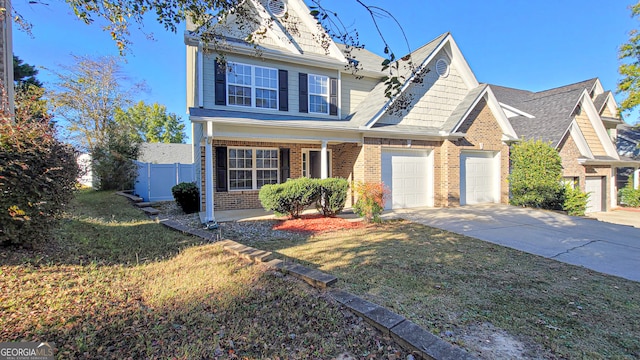 view of front facade featuring a garage and a front lawn