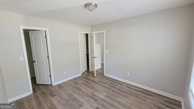 unfurnished bedroom with light hardwood / wood-style floors