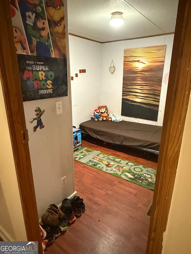 bedroom with wood-type flooring