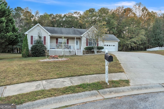 ranch-style house featuring a porch, a front lawn, and a garage