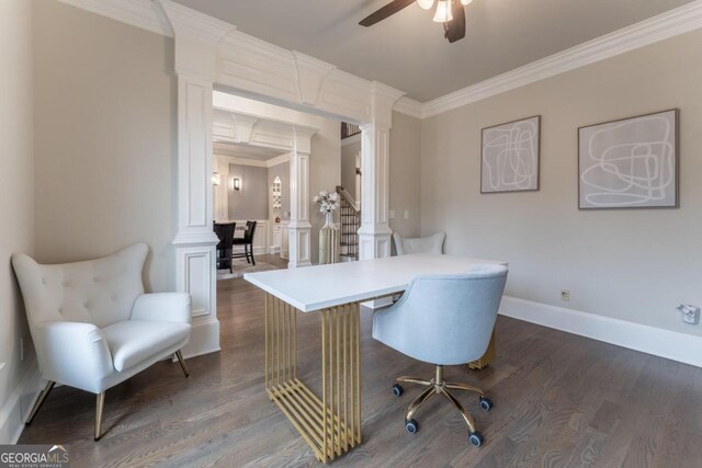 office area featuring dark wood-type flooring, ceiling fan, crown molding, and decorative columns