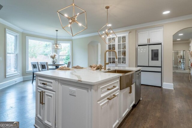 kitchen with a center island with sink, dark wood-type flooring, white cabinets, and white fridge