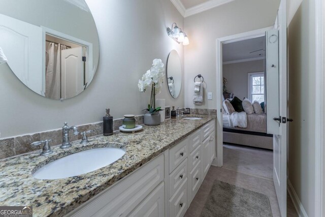 bathroom featuring vanity and ornamental molding