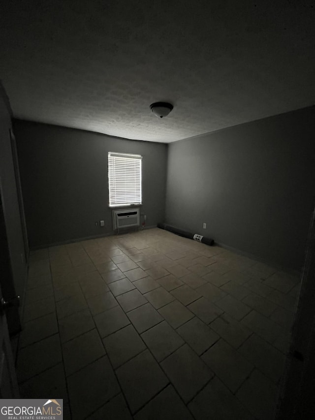 121-123 E King Ave, Kingsland, GA 31548 - unfurnished room featuring tile patterned floors and a wall unit AC