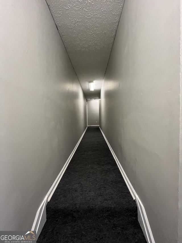 121-123 E King Ave, Kingsland, GA 31548 - corridor featuring carpet floors, a textured ceiling, and baseboards