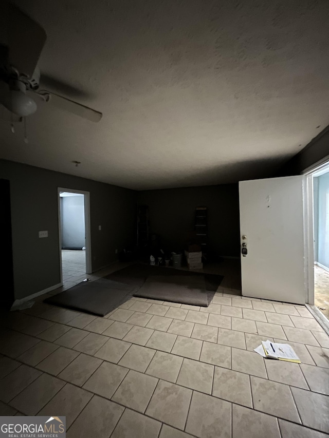 121-123 E King Ave, Kingsland, GA 31548 - unfurnished living room featuring ceiling fan and tile patterned floors