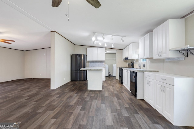 30 David Rd, Hinesville, GA 31313 - kitchen featuring a ceiling fan, black appliances, washing machine and clothes dryer, dark wood-style floors, and white cabinetry