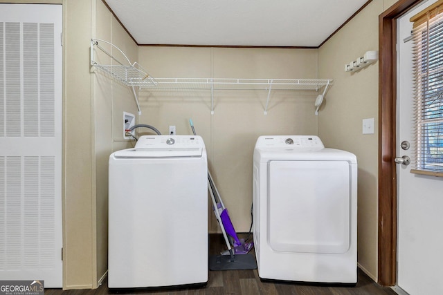 30 David Rd, Hinesville, GA 31313 - laundry room with a heating unit, washing machine and dryer, dark wood-style flooring, and ornamental molding