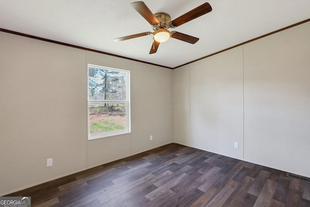 30 David Rd, Hinesville, GA 31313 - unfurnished room featuring ornamental molding, dark wood finished floors, and a ceiling fan