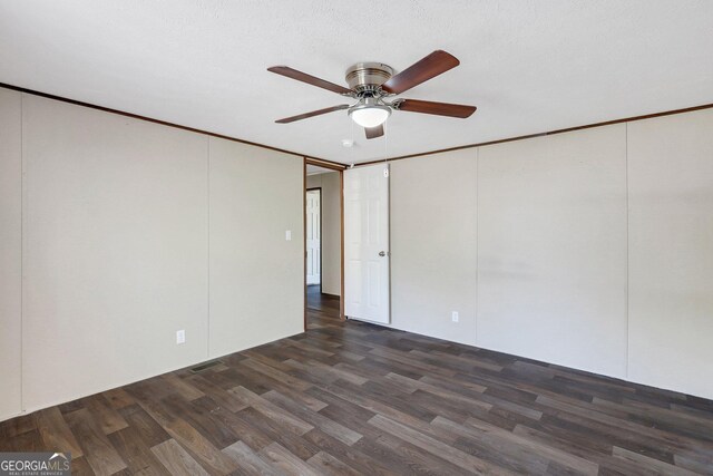 30 David Rd, Hinesville, GA 31313 - empty room featuring dark wood finished floors, ceiling fan, and ornamental molding